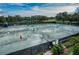 Active tennis courts with players enjoying a sunny day at this community amenity at 36750 Us Highway 19 N # 6-214, Palm Harbor, FL 34684