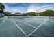 A spacious tennis court with clear markings and well-maintained nets, perfect for recreational play at 36750 Us Highway 19 N # 6-214, Palm Harbor, FL 34684