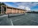 Wide angle view of the community tennis courts at 36750 Us Highway 19 N # 6-214, Palm Harbor, FL 34684