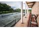 View of the community tennis courts and adjacent building at 36750 Us Highway 19 N # 6-214, Palm Harbor, FL 34684
