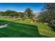Beautifully landscaped yard with manicured lawn, trees, and well-maintained hedges at 36750 Us Highway 19 N # 6-214, Palm Harbor, FL 34684