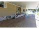 This shot shows a long carport leading to the front door. The space is well-kept at 36838 Tara Ave, Zephyrhills, FL 33542