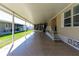 Spacious carport with a covered area, brick accents, and access to the home and screened in porch at 36838 Tara Ave, Zephyrhills, FL 33542