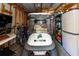 Organized garage with a golf cart, bicycles, and shelving providing ample storage space at 36838 Tara Ave, Zephyrhills, FL 33542