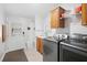 Functional laundry room equipped with modern washer, dryer, sink, and convenient storage cabinets at 36838 Tara Ave, Zephyrhills, FL 33542
