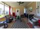 Inviting screened porch with comfortable seating, a ceiling fan, and a cozy atmosphere perfect for relaxation at 36838 Tara Ave, Zephyrhills, FL 33542