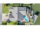 Aerial view showcasing the home's layout, including the pool, boat dock, and waterfront location at 4383 Biscayne Dr, Hernando Beach, FL 34607