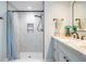 Bright bathroom featuring a walk-in shower, stylish vanity, and elegant fixtures at 4383 Biscayne Dr, Hernando Beach, FL 34607