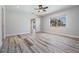 Spacious bedroom with ample natural light, laminate flooring, and a ceiling fan at 4383 Biscayne Dr, Hernando Beach, FL 34607
