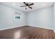 Empty bedroom offers new dark wood-look flooring and neutral paint at 4383 Biscayne Dr, Hernando Beach, FL 34607