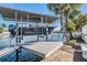 Modern boat lift on the canal, offering secure storage and easy launch for boating with dock and outdoor space at 4383 Biscayne Dr, Hernando Beach, FL 34607