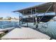 View of the boat lift on the canal, offering a convenient way to access the water for boating adventures at 4383 Biscayne Dr, Hernando Beach, FL 34607