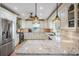 Well-appointed kitchen with granite countertops, stainless steel appliances, and custom cabinets at 4383 Biscayne Dr, Hernando Beach, FL 34607