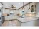 Bright kitchen with granite countertops, custom cabinetry, and stainless steel appliances at 4383 Biscayne Dr, Hernando Beach, FL 34607