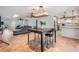 Open floor plan featuring an adjacent kitchen and living room with ceiling fans and tile flooring at 4383 Biscayne Dr, Hernando Beach, FL 34607
