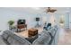 Inviting living area featuring ceramic tile flooring, large windows, and a cozy sectional sofa at 4383 Biscayne Dr, Hernando Beach, FL 34607
