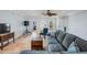 Open living room with tile floors, ceiling fan, and comfortable seating at 4383 Biscayne Dr, Hernando Beach, FL 34607