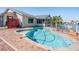 Relaxing backyard pool with brick patio, complemented by views of the canal and easy access to the boat dock at 4383 Biscayne Dr, Hernando Beach, FL 34607