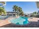 Private pool area with brick patio, ideal for relaxation and entertainment with views of the canal and boat dock at 4383 Biscayne Dr, Hernando Beach, FL 34607