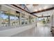 Enclosed sunroom with large windows offers water views at 4383 Biscayne Dr, Hernando Beach, FL 34607