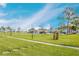 Beautifully landscaped community with lush green lawns and inviting walkways under a sunny, blue sky at 4715 Bay Ne St # 126, St Petersburg, FL 33703