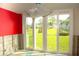 Living room during remodeling phase, with sliding glass doors showcasing the outdoor landscape at 4715 Bay Ne St # 126, St Petersburg, FL 33703