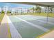 Shuffleboard courts with benches, trees and apartment buildings surrounding the recreational space at 4715 Bay Ne St # 126, St Petersburg, FL 33703