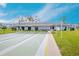 Well-maintained shuffleboard court surrounded by park benches, lush grass and the residential building at 4715 Bay Ne St # 126, St Petersburg, FL 33703