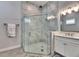 Bathroom with a glass enclosed shower and a double sink vanity at 5318 Wishing Arch Dr, Apollo Beach, FL 33572