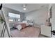 Charming bedroom with pink accents, decorative lighting, and natural light at 5318 Wishing Arch Dr, Apollo Beach, FL 33572