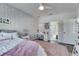 Charming bedroom with pink accents, decorative lighting, and a ensuite bathroom at 5318 Wishing Arch Dr, Apollo Beach, FL 33572