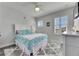 Cozy bedroom with stylish decor, shuttered windows, and a decorative initial on the wall at 5318 Wishing Arch Dr, Apollo Beach, FL 33572