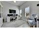 Well-lit home office with a large monitor, perfect for remote work and professional tasks at 5318 Wishing Arch Dr, Apollo Beach, FL 33572