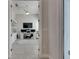 Bright home office with built-in shelving, providing an ideal space for remote work and productivity at 5318 Wishing Arch Dr, Apollo Beach, FL 33572