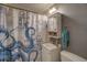 Charming bathroom with vanity, nautical themed decor, and an octopus themed shower curtain at 5704 Half Moon Lake Rd, Tampa, FL 33625