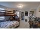 Comfortable bedroom with bunk beds, a closet, and space for a desk or play area at 5704 Half Moon Lake Rd, Tampa, FL 33625