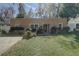 Inviting home with well-maintained lawn, garden beds, and a neatly paved walkway to the front door at 5704 Half Moon Lake Rd, Tampa, FL 33625