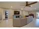 Bright and airy living space with tile flooring, modern furniture, and cozy sectional sofa at 5704 Half Moon Lake Rd, Tampa, FL 33625