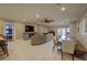 Open-concept living space with tile flooring, modern furniture, and outdoor access to the lake at 5704 Half Moon Lake Rd, Tampa, FL 33625