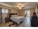 Tranquil main bedroom featuring a comfortable king-size bed and an en-suite bathroom at 5704 Half Moon Lake Rd, Tampa, FL 33625