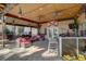 Enjoy this covered brick patio with bar, ceiling fans, and lounge seating, perfect for relaxing and entertaining outdoors at 5704 Half Moon Lake Rd, Tampa, FL 33625