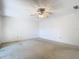 Spacious bedroom featuring neutral carpet and a ceiling fan for added comfort at 6323 Newtown Cir # 23A1, Tampa, FL 33615