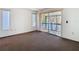 Carpeted bedroom with sliding glass doors leading to a balcony with water views at 6323 Newtown Cir # 23A1, Tampa, FL 33615