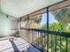 Screened porch area with views of the lake and lush greenery at 6323 Newtown Cir # 23A1, Tampa, FL 33615
