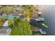 Waterfront home with a dock, boat house, and lush backyard at 680 George S St, Tarpon Springs, FL 34688