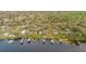 Aerial view of waterfront homes with private docks on a picturesque lake at 680 George S St, Tarpon Springs, FL 34688
