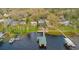 Aerial view of lakefront property with boat docks at 680 George S St, Tarpon Springs, FL 34688
