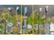 Aerial view of the waterfront home, highlighted in yellow, featuring a boat dock at 680 George S St, Tarpon Springs, FL 34688