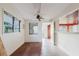 Bright bonus room with a ceiling fan, brick floors, and an open layout at 680 George S St, Tarpon Springs, FL 34688