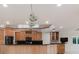 This kitchen has wood cabinets, stainless appliances, and dark countertops at 680 George S St, Tarpon Springs, FL 34688
